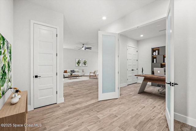 998 Wacona St SE, Palm Bay, FL 32909 - hallway with a desk, light wood-type flooring, baseboards, and recessed lighting