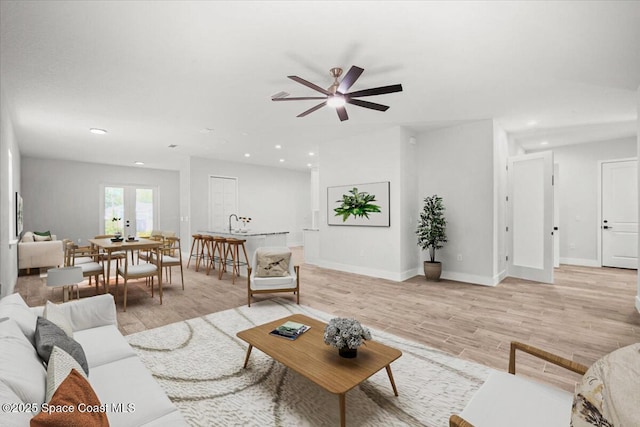 998 Wacona St SE, Palm Bay, FL 32909 - living area featuring a ceiling fan, recessed lighting, light wood finished floors, and baseboards