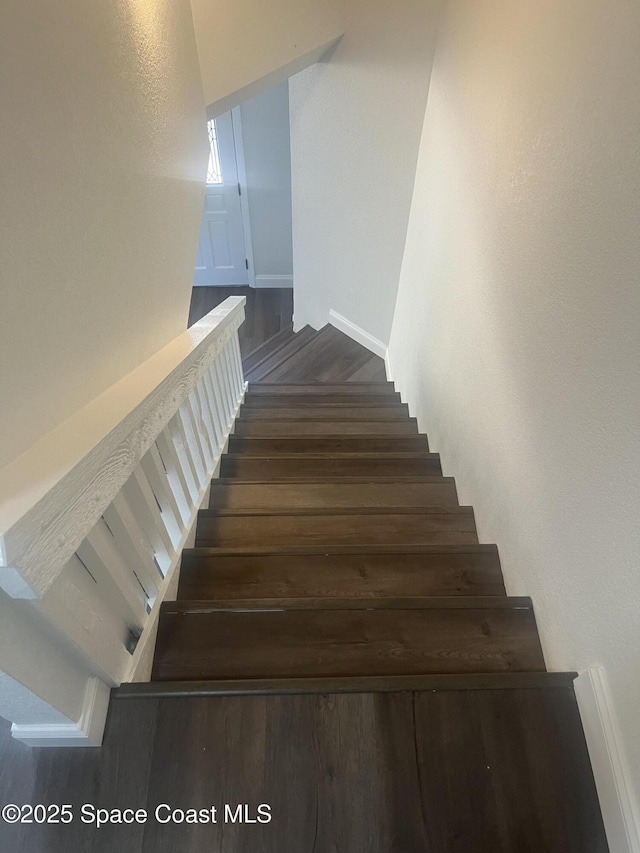 113 Harbor Dr, Cape Canaveral, FL 32920 - stairway featuring wood finished floors and baseboards