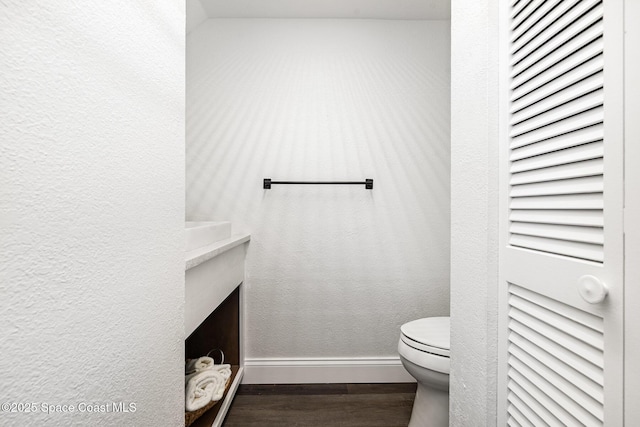 113 Harbor Dr, Cape Canaveral, FL 32920 - bathroom featuring wood finished floors and a textured wall