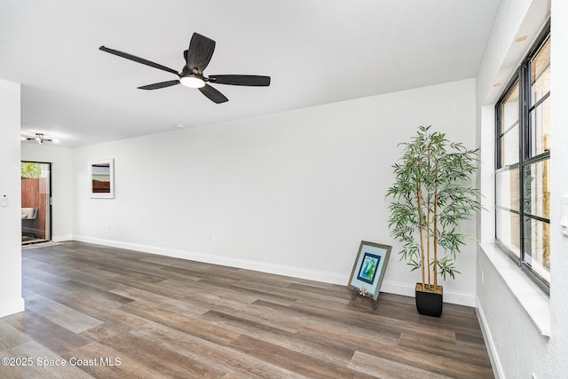 113 Harbor Dr, Cape Canaveral, FL 32920 - unfurnished room featuring wood finished floors and a ceiling fan