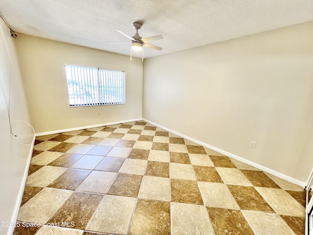 22 Tulip Ave Unit 330, Cocoa Beach, FL 32931 - unfurnished room with a ceiling fan and a textured ceiling
