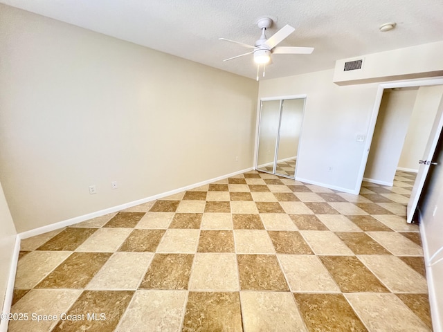 22 Tulip Ave Unit 330, Cocoa Beach, FL 32931 - unfurnished bedroom featuring a closet and ceiling fan
