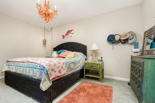 bedroom featuring carpet floors, baseboards, and a chandelier