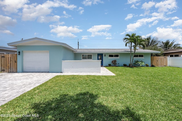 225 Price Ct, Satellite Beach, FL 32937 - ranch-style house featuring a garage, stucco siding, and decorative driveway