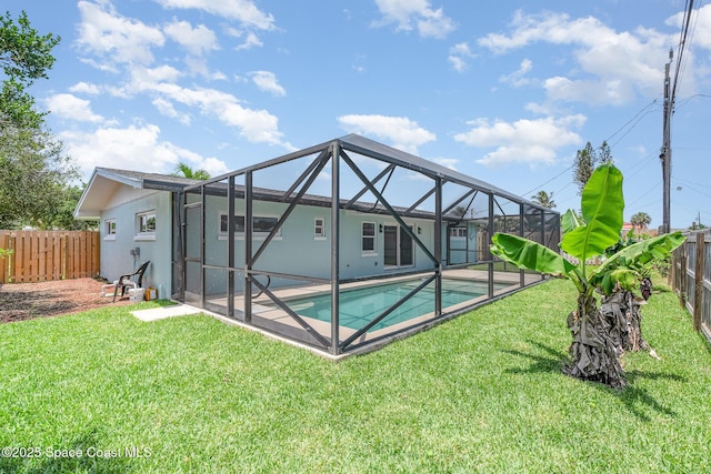 225 Price Ct, Satellite Beach, FL 32937 - rear view of property featuring glass enclosure, stucco siding, and a patio