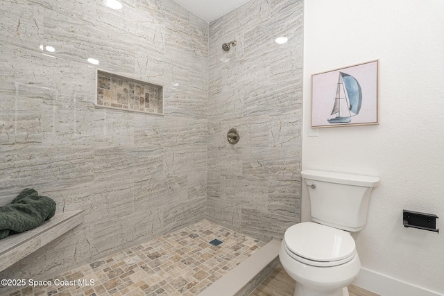225 Price Ct, Satellite Beach, FL 32937 - full bathroom with tiled shower, toilet, and baseboards