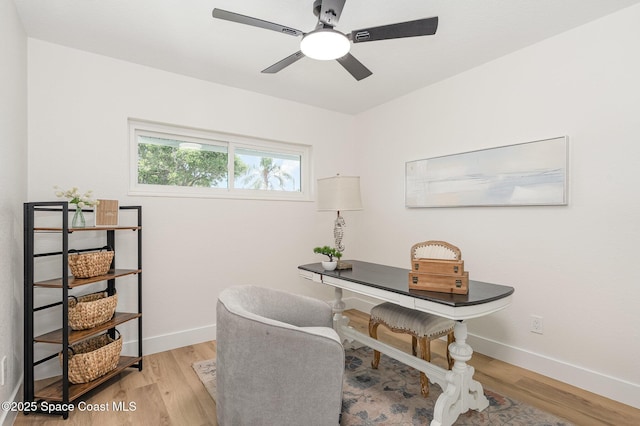 225 Price Ct, Satellite Beach, FL 32937 - home office with light wood-style flooring, ceiling fan, and baseboards