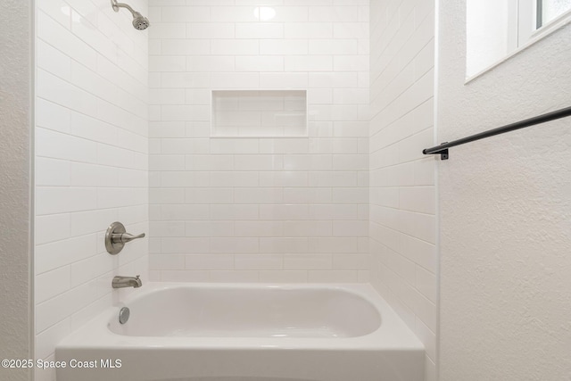 225 Price Ct, Satellite Beach, FL 32937 - full bath featuring a textured wall and shower / washtub combination