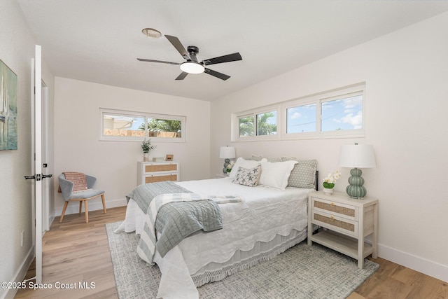 225 Price Ct, Satellite Beach, FL 32937 - bedroom with light wood-style flooring, baseboards, and a ceiling fan