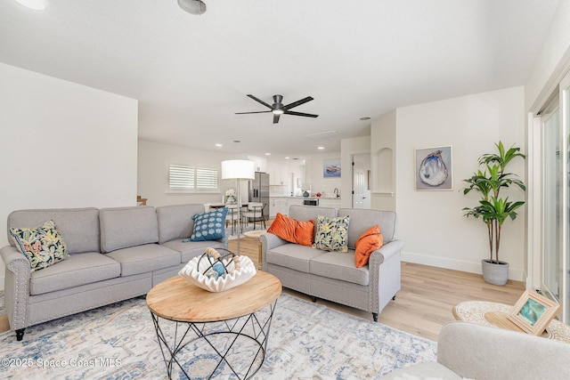 225 Price Ct, Satellite Beach, FL 32937 - living area with light wood-style floors, ceiling fan, baseboards, and recessed lighting