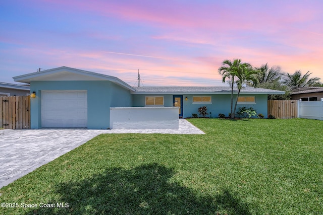 225 Price Ct, Satellite Beach, FL 32937 - single story home with a garage, stucco siding, and decorative driveway