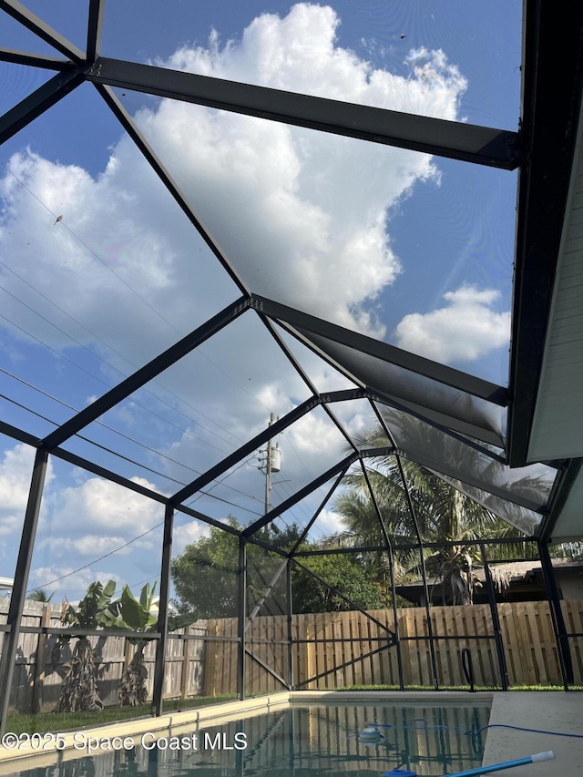 225 Price Ct, Satellite Beach, FL 32937 - view of swimming pool featuring a fenced backyard and glass enclosure