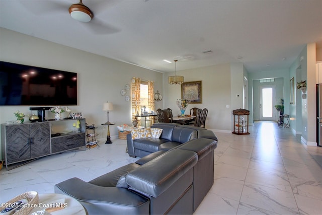 2242 Great Belt Cir, Melbourne, FL 32940 - living area featuring light marble finish floors and baseboards