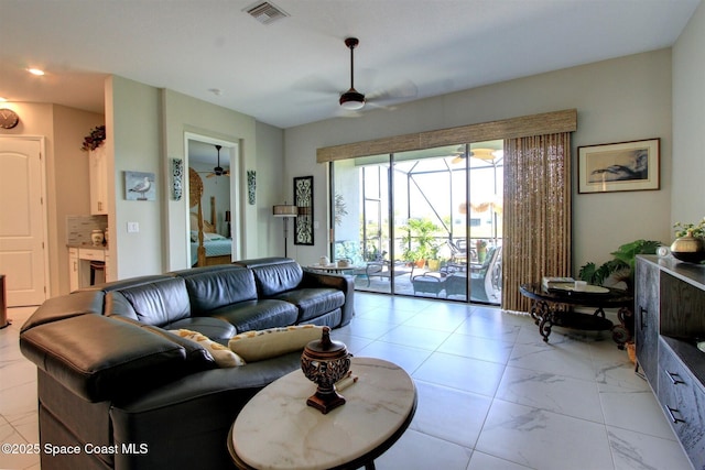 2242 Great Belt Cir, Melbourne, FL 32940 - living area with a ceiling fan and light marble finish floors