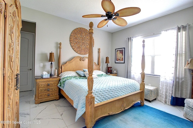 2242 Great Belt Cir, Melbourne, FL 32940 - bedroom featuring ceiling fan and light marble finish flooring