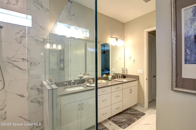 2242 Great Belt Cir, Melbourne, FL 32940 - bathroom featuring marble look tile flooring, double vanity, and a marble finish shower