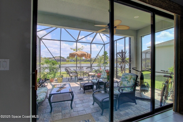 2242 Great Belt Cir, Melbourne, FL 32940 - view of patio / terrace featuring glass enclosure, a water view, and outdoor dining space