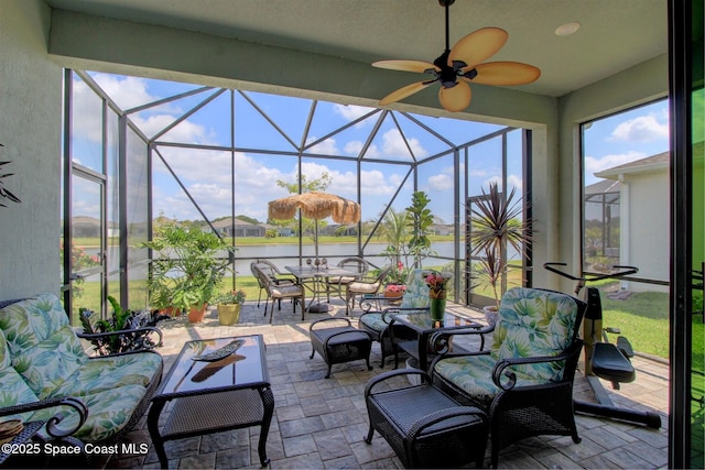 2242 Great Belt Cir, Melbourne, FL 32940 - view of patio / terrace featuring outdoor dining space, a water view, glass enclosure, and a ceiling fan