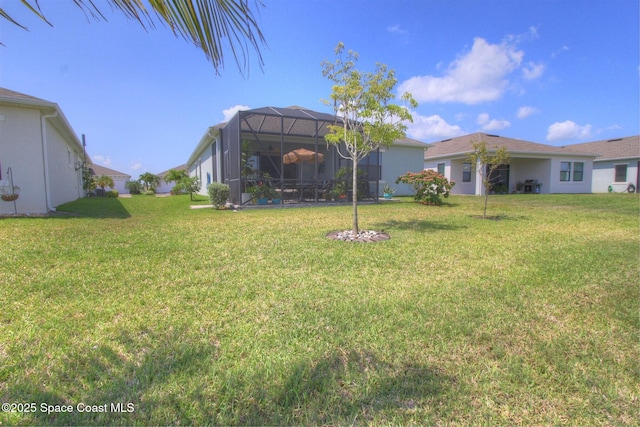 2242 Great Belt Cir, Melbourne, FL 32940 - view of green lawn featuring a lanai