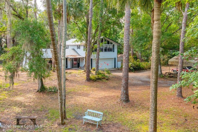 view of front of house featuring an attached garage and driveway
