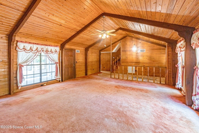 additional living space featuring wood walls, wood ceiling, carpet flooring, and ceiling fan