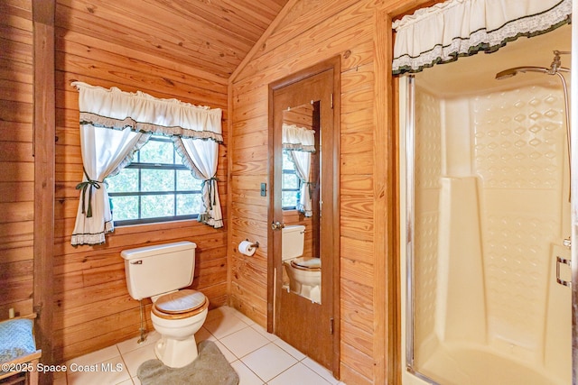 bathroom featuring toilet, vaulted ceiling, tile patterned flooring, a stall shower, and wood ceiling