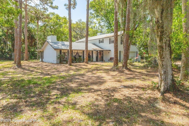 back of property featuring a chimney