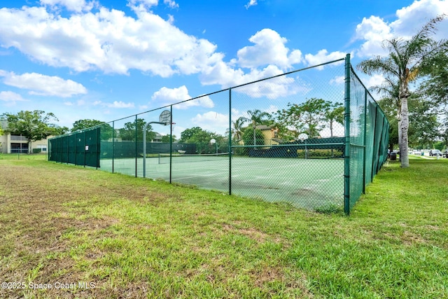 view of tennis court with community basketball court