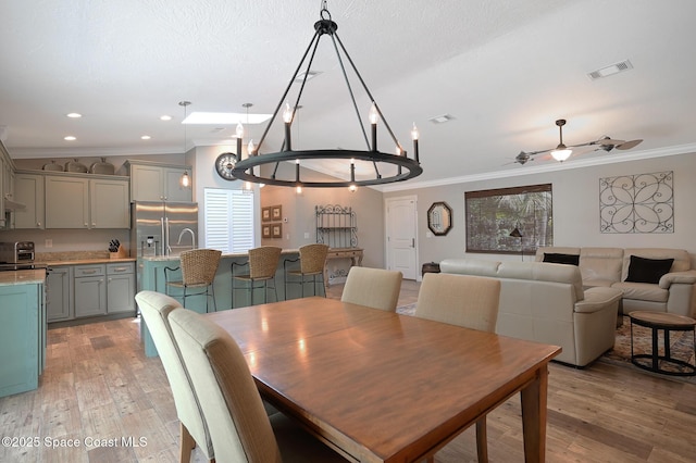 280 Pelican Dr, Melbourne Beach, FL 32951 - dining room with crown molding, light wood-style flooring, ceiling fan, and recessed lighting
