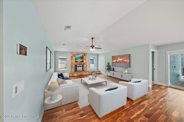 6345 Anchor Ln, Rockledge, FL 32955 - living room featuring wood finished floors, vaulted ceiling, a ceiling fan, and baseboards