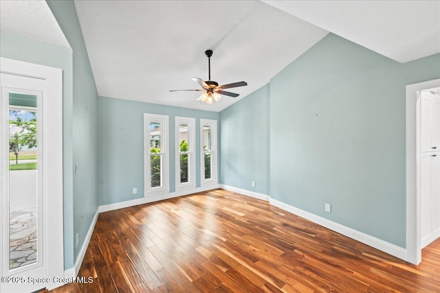 6345 Anchor Ln, Rockledge, FL 32955 - spare room featuring hardwood / wood-style flooring, baseboards, ceiling fan, and lofted ceiling