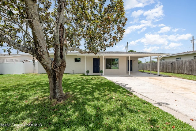 878 Iroquois Ave, Melbourne, FL 32935 - single story home featuring stucco siding, driveway, a carport, and a patio