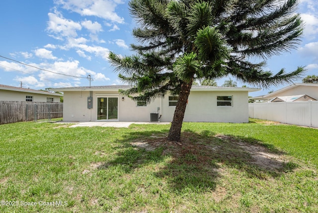 878 Iroquois Ave, Melbourne, FL 32935 - rear view of property with stucco siding, cooling unit, and a patio area