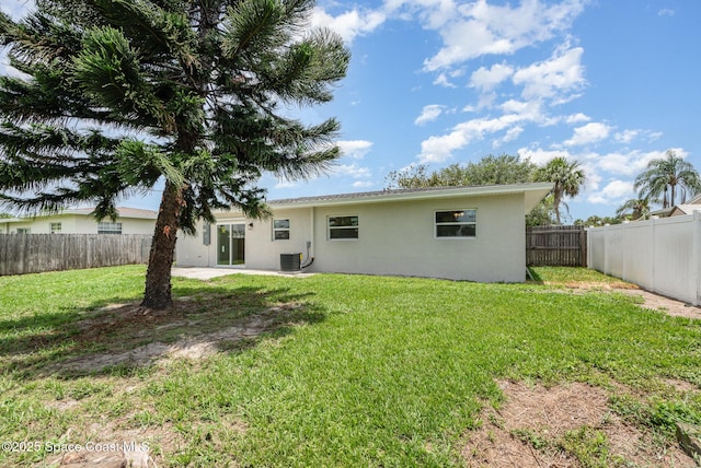 878 Iroquois Ave, Melbourne, FL 32935 - back of house with stucco siding, cooling unit, and a patio area