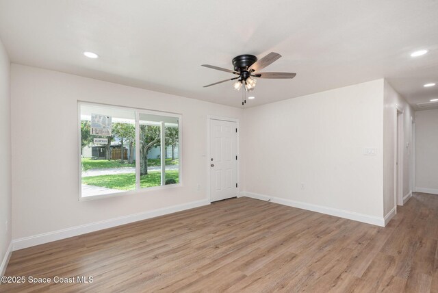 878 Iroquois Ave, Melbourne, FL 32935 - empty room with light wood-style flooring, a ceiling fan, recessed lighting, and baseboards