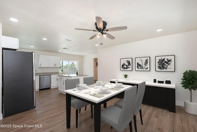 878 Iroquois Ave, Melbourne, FL 32935 - dining area with wood finished floors, ceiling fan, recessed lighting, and baseboards