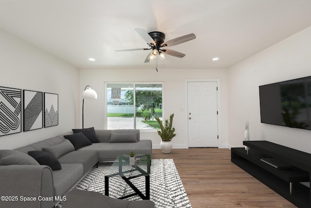 878 Iroquois Ave, Melbourne, FL 32935 - living area with wood finished floors, ceiling fan, recessed lighting, and baseboards