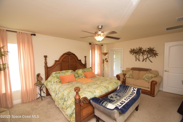 bedroom with light carpet and ceiling fan