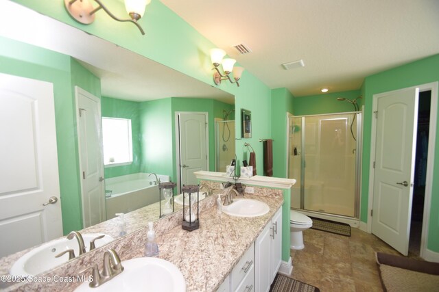 full bath featuring a shower stall, double vanity, a bath, and toilet