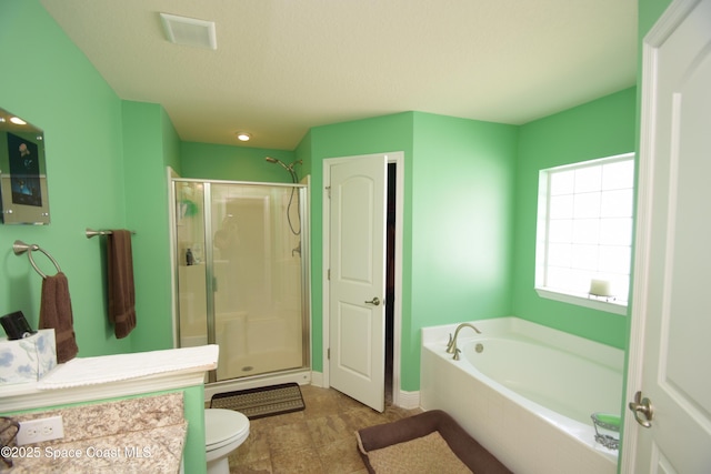 full bathroom with a shower stall, a bath, toilet, and vanity
