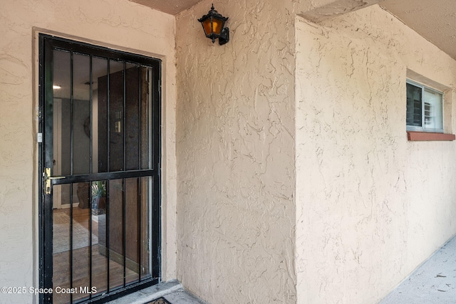 55 Riverside Dr Unit 103, Cocoa, FL 32922 - property entrance featuring stucco siding