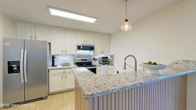 4047 Meander Pl Unit 205, Rockledge, FL 32955 - kitchen with stainless steel appliances, a peninsula, decorative backsplash, and a sink