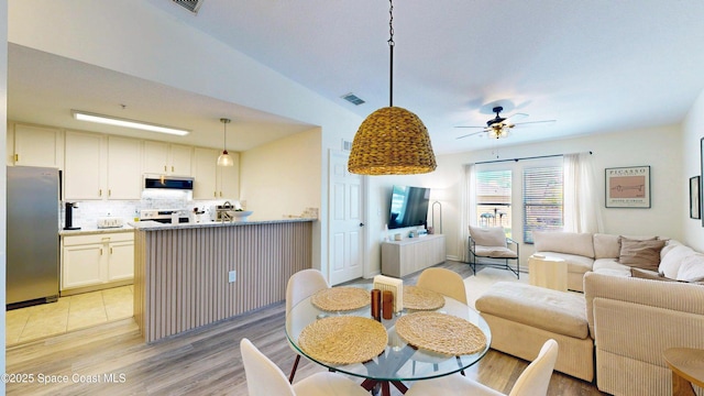4047 Meander Pl Unit 205, Rockledge, FL 32955 - dining room featuring ceiling fan and light wood-type flooring