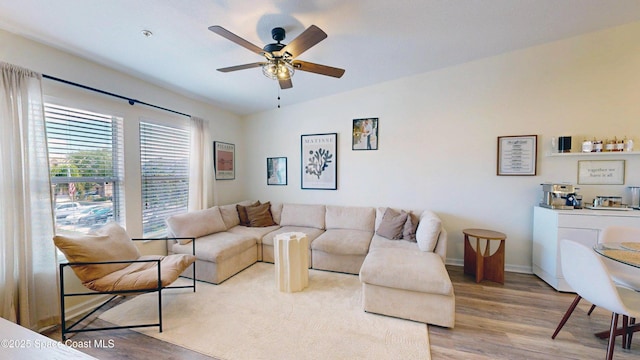 4047 Meander Pl Unit 205, Rockledge, FL 32955 - living area featuring wood finished floors, ceiling fan, and baseboards