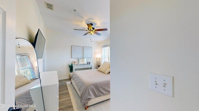 4047 Meander Pl Unit 205, Rockledge, FL 32955 - bedroom featuring light wood-style flooring and baseboards