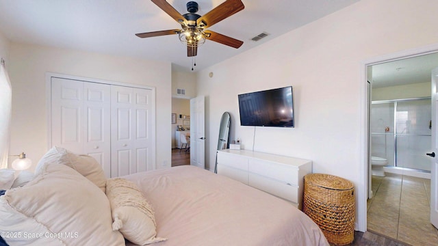 4047 Meander Pl Unit 205, Rockledge, FL 32955 - bedroom featuring a closet, wood finished floors, ensuite bathroom, and ceiling fan