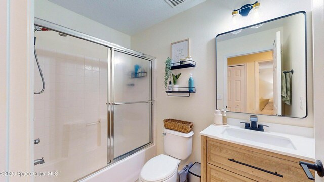 4047 Meander Pl Unit 205, Rockledge, FL 32955 - full bath with vanity, combined bath / shower with glass door, and toilet