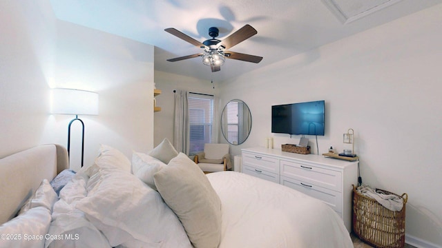 4047 Meander Pl Unit 205, Rockledge, FL 32955 - bedroom with ceiling fan and baseboards