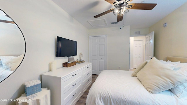 4047 Meander Pl Unit 205, Rockledge, FL 32955 - bedroom with dark wood-type flooring, a closet, attic access, and ceiling fan